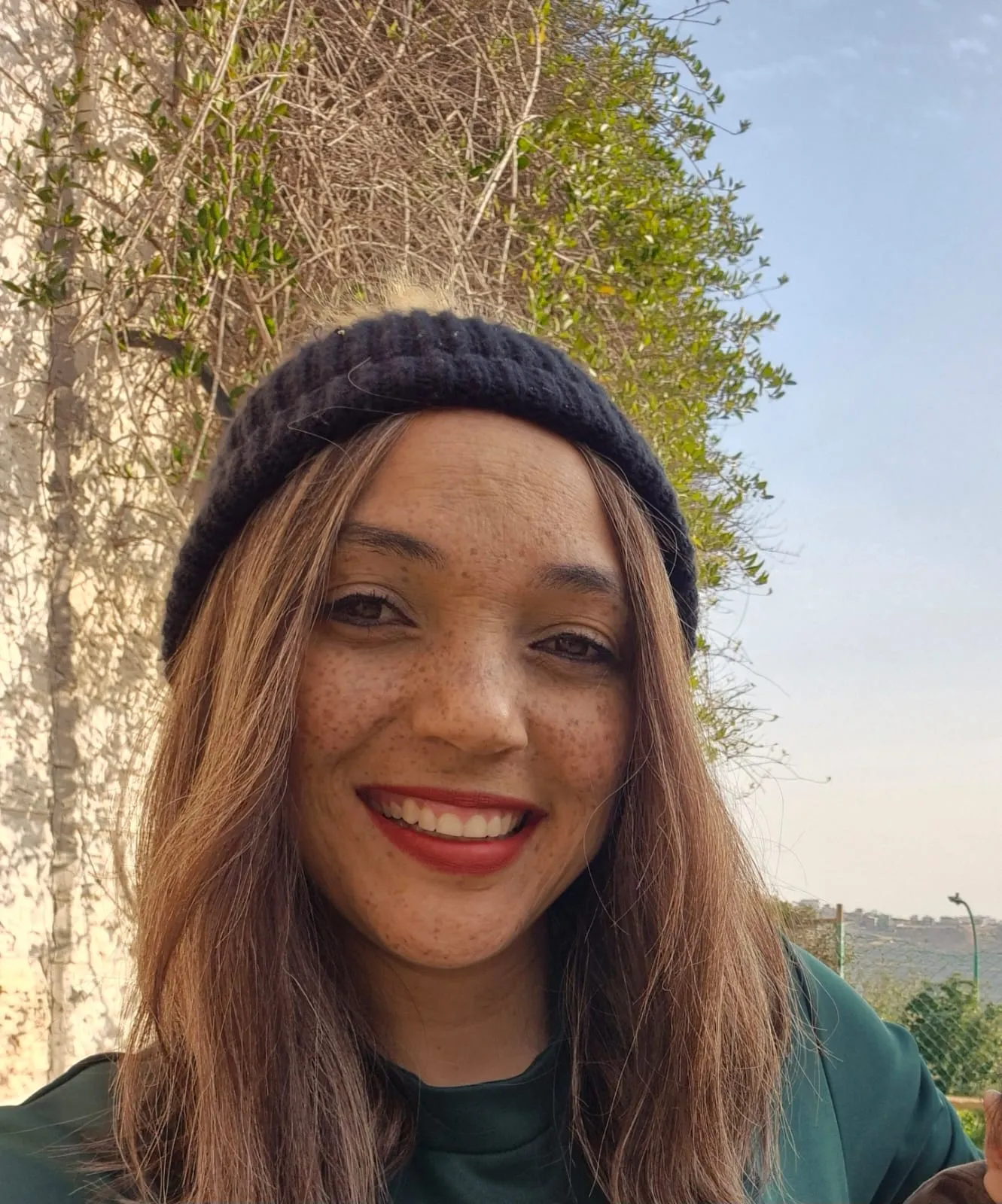 Simcha Chaya, founder of Hiddurah, smiling outdoors.
